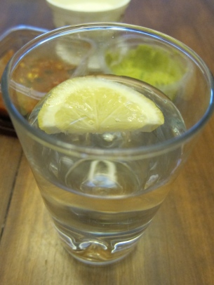 Water with lemon is the perfect accompaniment. It's better with lime, but have you seen the price of limes?! Yikes!